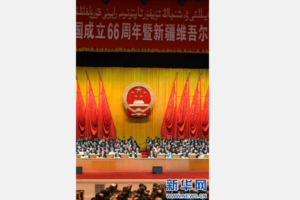10月1日，慶祝中華人民共和國成立66周年暨新疆維吾爾自治區(qū)成立60周年大會(huì)在新疆人民會(huì)堂隆重舉行。 新華社記者 高潔 攝 
